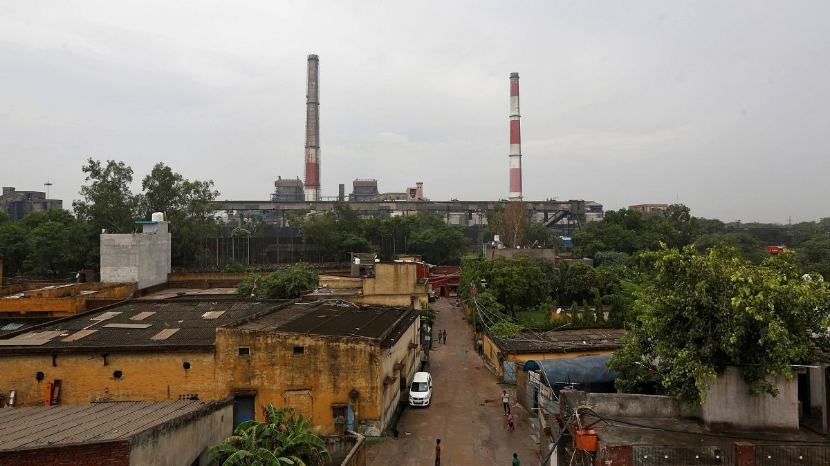 Chimneys of a coal-fired power plant are pictured in New Delhi, India, July 2017.