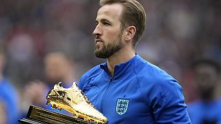 England's Harry Kane receives a trophy for the highest goalscorer of England at Wembley Stadium in London, Sunday, March 26, 2023.