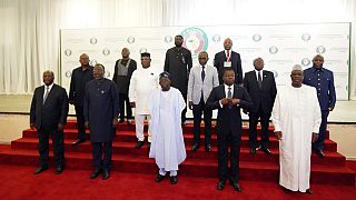 Nigeria's President, Bola Ahmed Tinubu, centre first row, poses for a group photo with other West African leaders before an ECOWAS meeting in Abuja, Nigeria. Thursday, Aug. 10