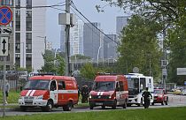 Police and emergency vehicles parked near the Karamyshevskaya embankment after a reported drone attack in Moscow, Russia, Aug 11, 2023