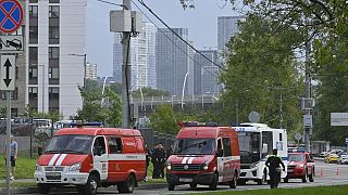 Police and emergency vehicles parked near the Karamyshevskaya embankment after a reported drone attack in Moscow, Russia, Aug 11, 2023