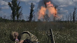 A Ukrainian soldier fires a mortar towards Russian positions at the front line, near Bakhmut, Donetsk region, Ukraine.