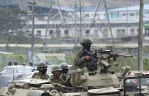 Armored vehicles enter the Deprivation of Liberty Center of the Zone 8 in Guayaquil, Ecuador, Saturday, Aug. 12, 2023.