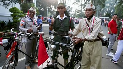 Military officers and civilians taking part in the flag parade in Bogor, Indonesia.