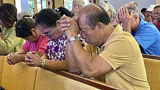 Parishioners attend Mass at Sacred Hearts Mission Church in Kapalua, Hawaii, Sunday, Aug. 13, 2023.