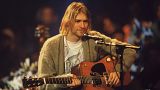 Kurt Cobain playing his acoustic guitar for the recording of Nirvana's 1994 'Unplugged' album
