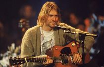 Kurt Cobain playing his acoustic guitar for the recording of Nirvana's 1994 'Unplugged' album