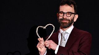 US screen writer and producer Charlie Kaufman receives and holds honorary "Heart of Sarajevo" award