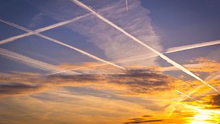 Contrails from planes can trap heat in the atmosphere.