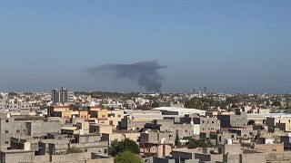 Civilians trapped home as militia clashes rock Libya's capital