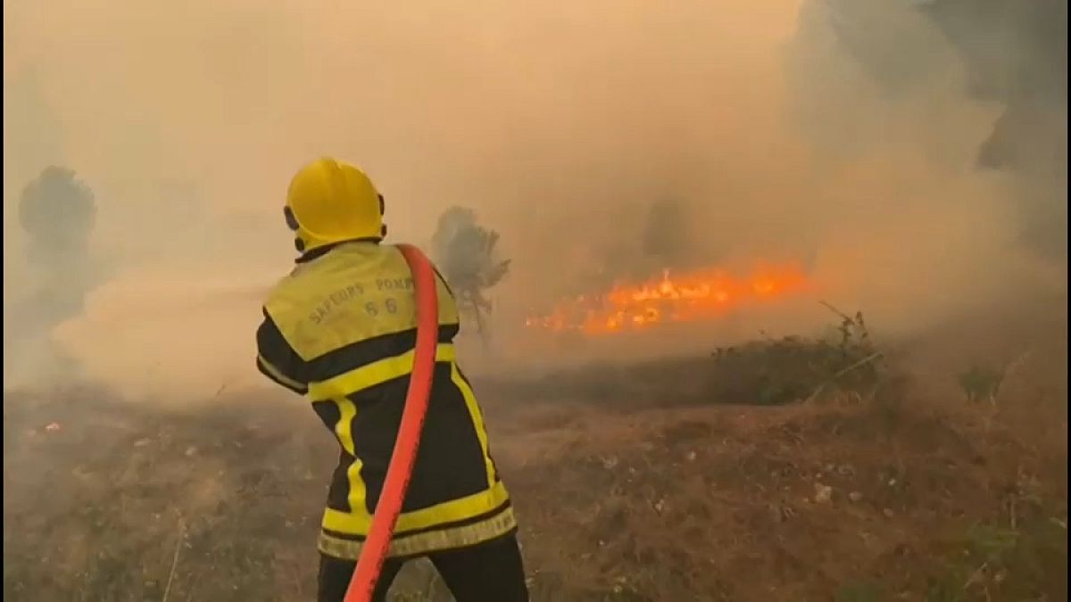 A firefighter tackles the blaze near the French border with Spain, August 15, 2023