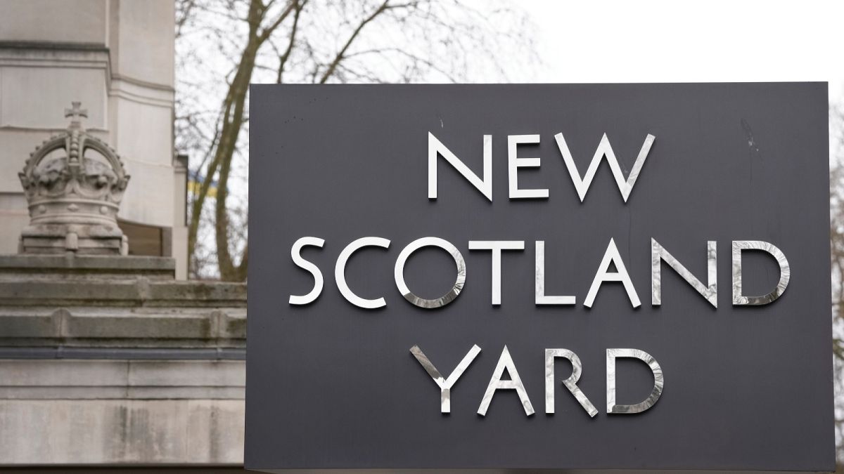 FILE: A sign outside New Scotland Yard, the headquarters of the London Metropolitan Police, in London, Tuesday, March 21, 2023.