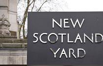 FILE: A sign outside New Scotland Yard, the headquarters of the London Metropolitan Police, in London, Tuesday, March 21, 2023.