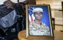 A portrait of American soldier Travis King is displayed as his grandfather, Carl Gates, talks about his grandson on July 19, 2023, in Kenosha, Wisconsin.