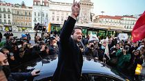 Andre Ventura, leader of the populist party Chega gestures while campaigning in downtown Lisbon, Friday, Jan. 28, 2022.