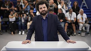 Director Saeed Roustayi poses for photographers at the photo call for the film "Leila's Brothers" at the 75th international film festival, Cannes.