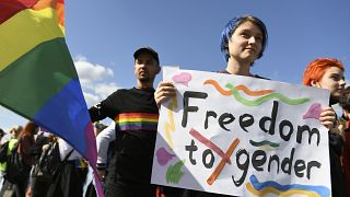 Participants march with a rainbow flag during the LGBT Pride parade in Kharkiv, Ukraine. 15 September 2019