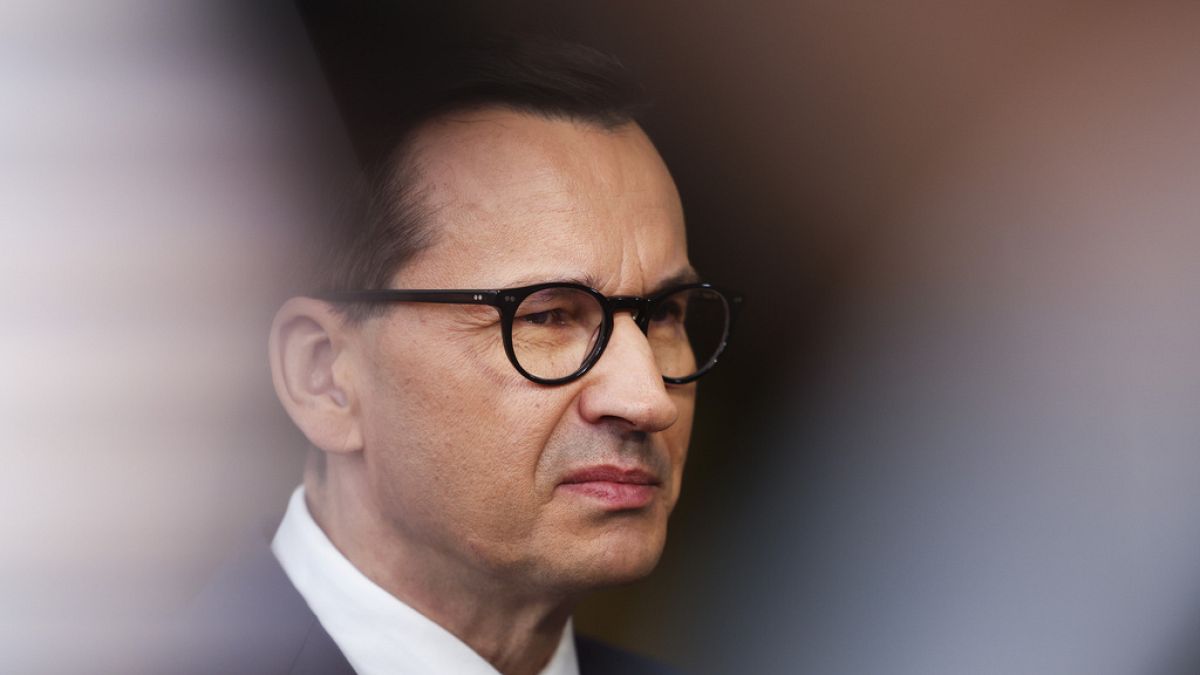Poland's Prime Minister Mateusz Morawiecki talks to journalists as he arrives for the third EU-CELAC summit in Brussels, Belgium, Tuesday, July 18, 2023.