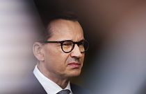 Poland's Prime Minister Mateusz Morawiecki talks to journalists as he arrives for the third EU-CELAC summit in Brussels, Belgium, Tuesday, July 18, 2023.