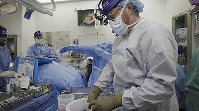 Dr. Robert Montgomery, director of NYU Langone’s transplant institute, prepares a pig kidney for transplant into a brain-dead man in New York on July 14, 2023. 
