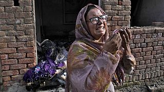 A Christian woman weeps after looking at her home vandalized by an angry Muslim mob in Jaranwala in the Faisalabad district, Pakistan, Thursday, Aug. 17, 2023.