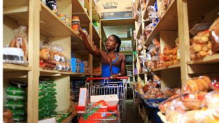 A woman shops at a grocery store in Hoima town, Uganda, 27 April, 2015. 