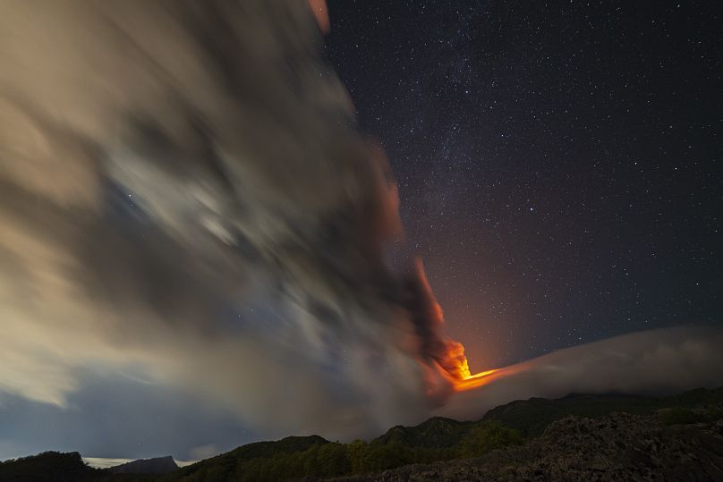 Smoke billows from Mount Etna, as seen from an area near the village of Sant'Alfio, north of Catania, Sicily, 12 November 2023.
