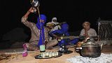 Local tour guides set up camp in the desert near the oasis town of Djanet in southeastern Algeria 