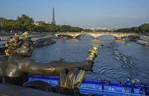 Athletes swim in the Seine river from the Alexander III bridge on the first leg of the women's triathlon test event for the Paris 2024 Olympics Games. Paris, Aug. 17, 2023 