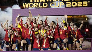 Team Spain celebrates with the trophy after winning the Women's World Cup soccer final against England at Stadium Australia in Sydney, Australia, Sunday, Aug. 20, 2023.