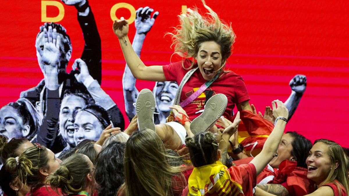 Spain women's national football team's players lift Spain's Olga Carmona as they celebrate on stage their 2023 World Cup victory in Madrid, Spain.
