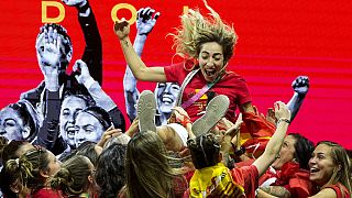 Spain women's national football team's players lift Spain's Olga Carmona as they celebrate on stage their 2023 World Cup victory in Madrid, Spain.