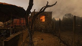 A warehouse on fire in the village of Dikela, near Alexandroupolis town, in the northeastern Evros region, Greece, Tuesday, Aug. 22, 2023.