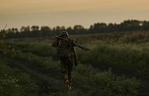 A Ukrainian soldier of the 53rd brigade approaches his position at the frontline close to Donetsk, Ukraine