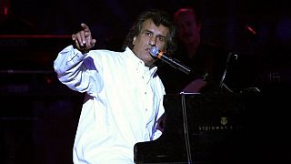 Italian singer and composer Toto Cutugno performs ln July 2002 at the Roman theatre in Cartagena outside Tunis during the 38th international festival.