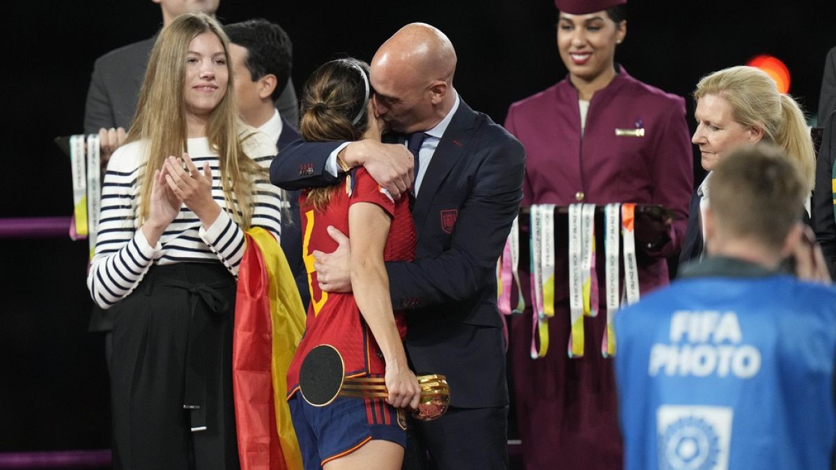 President of Spain's soccer federation, Luis Rubiales, right, hugs Spain's Aitana Bonmati on the podium following Spain's win in the final of Women's World Cup soccer.