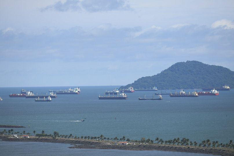 Cargo ships wait in the Pacific Ocean to pass though the Panama Canal during delays in August when ship numbers were first cut.