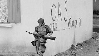 A soldier of the French army is shown in position at the corner of a building in the St. Eugene district of Oran in Algeria, April 28, 1962.