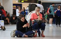 Passengers wait at Belfast International Airport, Ireland, 28 August 2023.