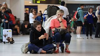 Passengers wait at Belfast International Airport, Ireland, 28 August 2023.