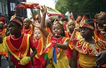 Participants dance during the Children's Day Parade, part of the Notting Hill Carnival celebration in west London