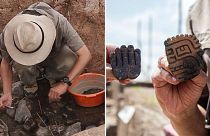 Handout picture released by the Peruvian Ministry of Culture showing archaeologists holding pottery pieces found at a 3,000-year-old priest's tomb,