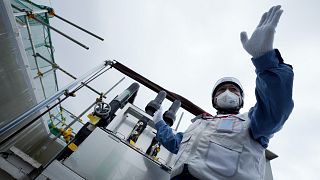 A TEPCO official at the treated water dilution and discharge facility 