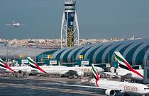 An Emirates jetliner comes in for landing at the Dubai International Airport in Dubai, United Arab Emirates, Dec. 11, 2019.