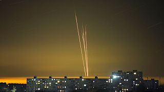 FILE - Four Russian rockets launched against Ukraine from Russia's Belgorod region are seen at dawn in Kharkiv, Ukraine, late Thursday, Feb. 16, 2023.