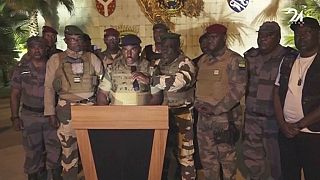 Video grab shows the spokesperson for the mutinous soldiers speaking on state television as they announce that they had seized power in Libreville, Wednesday Aug. 30, 2023. 