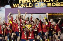 Team Spain celebrates with the trophy after winning the Women's World Cup soccer final against England at Stadium Australia in Sydney, Australia, Aug. 20, 2023.