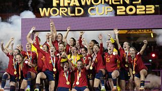Team Spain celebrates with the trophy after winning the Women's World Cup soccer final against England at Stadium Australia in Sydney, Australia, Aug. 20, 2023.
