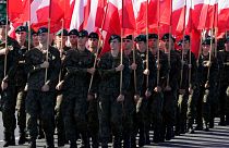 Members of the new voluntary Territorial Defense Troops march with Poland's national flags in a massive military parade to celebrate the Polish Army Day on 15 August, 2023.