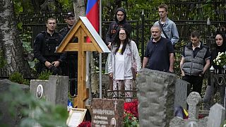 People gather at the grave of Wagner Group's chief Yevgeny Prigozhin, who died last week in a plane crash two months after launching his brief rebellion.